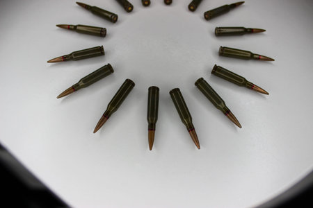 Circle Of Ammunition Laid Out On White Surface