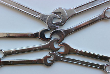 Combination wrenches of different sizes inserted into each other with open endsの写真素材