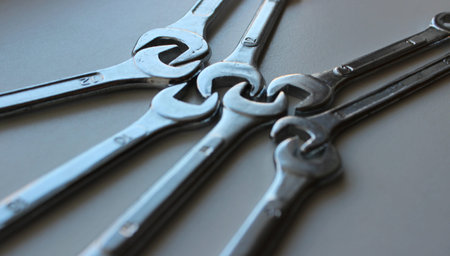 Teamwork Concept Image. Variety Size Spanners Connected To Each Other Head In Head Closeup View