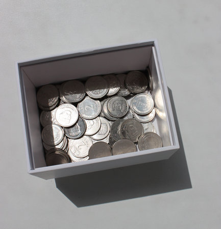Square Photo Of Cardboard Money Box With Scattered Ukrainian Coins With Different Denominationの写真素材