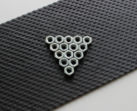 Hex Nuts In A Form Of Play Sign On A Plastic Protection Panel