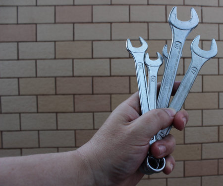 Bunch Of Steel Hex Wrenches In A Hand Of Mechanician Stock Photo