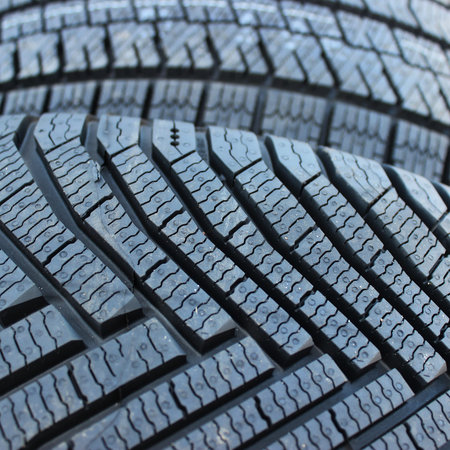 Types Of Tires Tread Pattern Design. Grooves And Siped Of Directional Tires Closeup Square Stock...