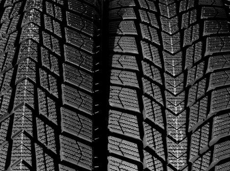 Directional design of the tread of car tires turned in different side of rotation. Textured pattern...