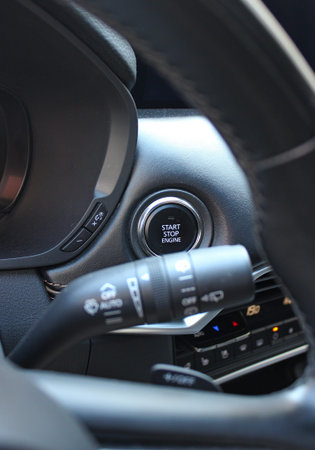 Function Buttons And Electronic Controls On Car Dashboard Under Steering Wheel