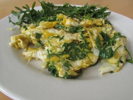 scrambled eggs with rocket saladの写真素材