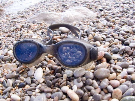 Glasses for navigation on a sea beachの写真素材