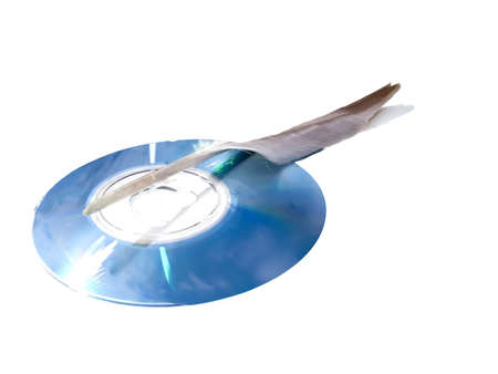 Laser disk for a computer and the bird's featherの写真素材
