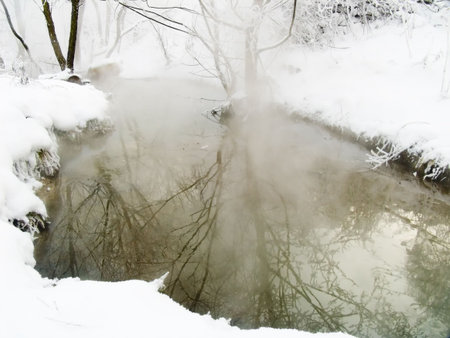 Winter landscape in frosty day with the riverの写真素材