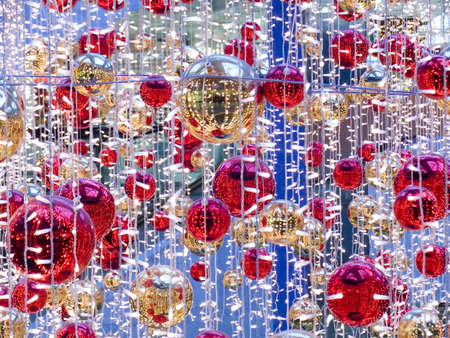 Celebratory Christmas ornament with spheres and multi-colored streamerの写真素材