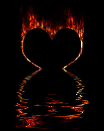 Burning fiery contour of heart on a black background. Immersing in waterの写真素材