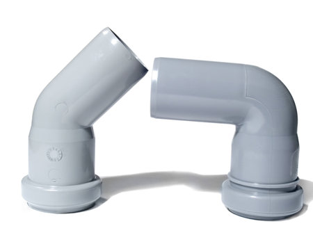 Two angular plastic fitting for the device of the water drain isolated on a white backgroundの写真素材