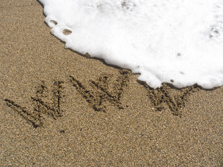 WWW it is drawn but wet sea sandの写真素材