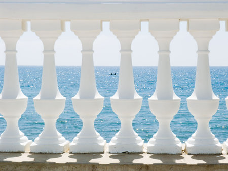 White balustrade on seacoastの写真素材