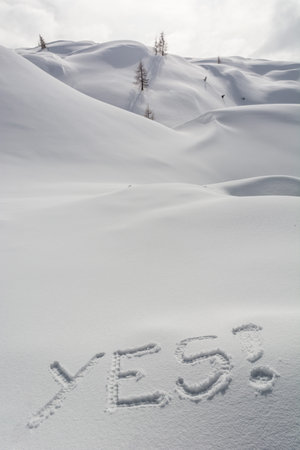 Word YES written in the snow