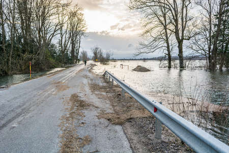 Debris lying on a road left after spring floodの写真素材