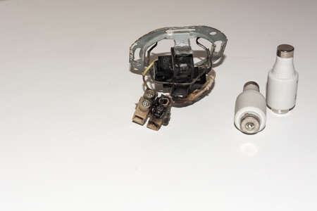 Damaged electrical socket with two electrical fusesの写真素材