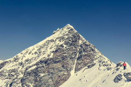 Person starting to ascend a mountain, Ankogel, Austria