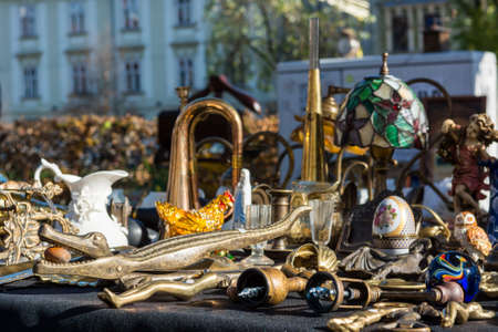 Flea market stand with many objects on displayの写真素材