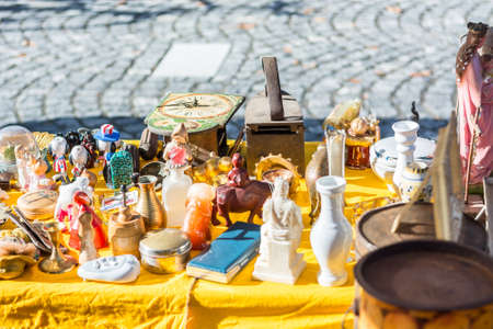 Flea market stand with many objects on displayの写真素材