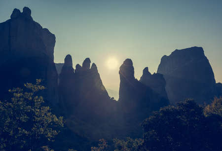 Sun setting behind sandstone rocks, Meteora, Greeceの写真素材