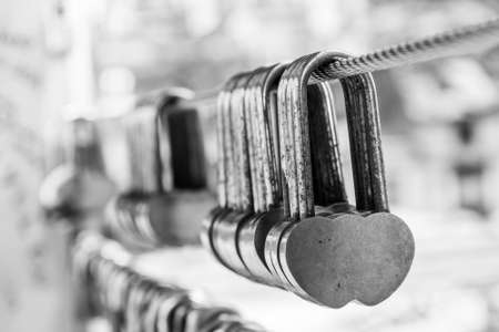 Chain of identical love locks on a bridgeの写真素材