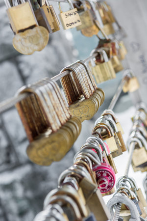 Chain of identical love locks on a bridge