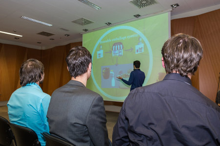 Conference and presentation. Audience listening to speaker.