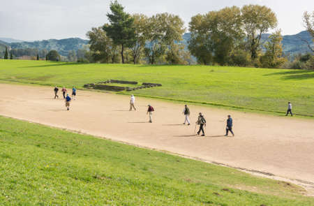 People running on an ancient stadium. の写真素材