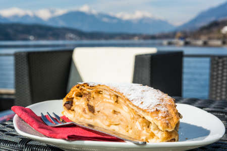 Delicious desert. Traditional apple strudel at a bar surrounded by mountains.の写真素材