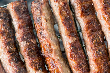 Minced meat on a grill. Barbeque with grilled meat.の写真素材