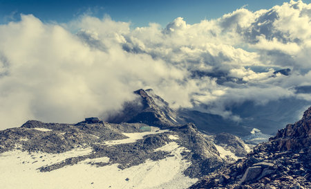 Aerial view of a mountain slopes covered with snow. Monte Rosa massif.