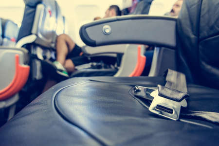 Airplane interior. Close up of safety belt on seat.の写真素材