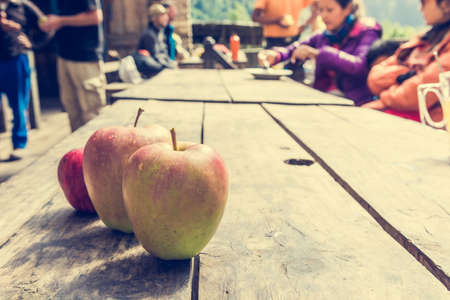 Apples on a wooden table. Fresh and organic fruit.の写真素材