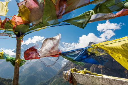 Praying flags on mountain background. Annapurna circuit in Nepal.