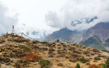 Praying flags with stupa on a mountain ridge. Annapurna region in Nepal.の写真素材