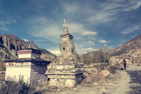 Buddhist stupa along Annapurna trek. Religious stone building.の写真素材