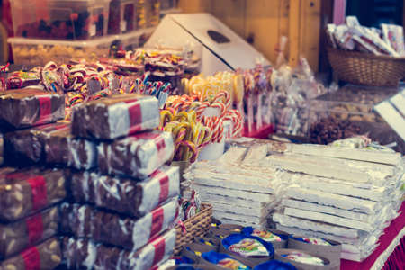 Christmas market with delicious sweets. Kiosk selling gifts.の写真素材