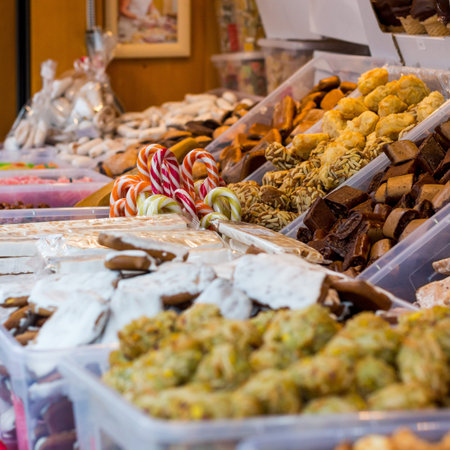 Christmas market with delicious sweets. Kiosk selling gifts.の写真素材