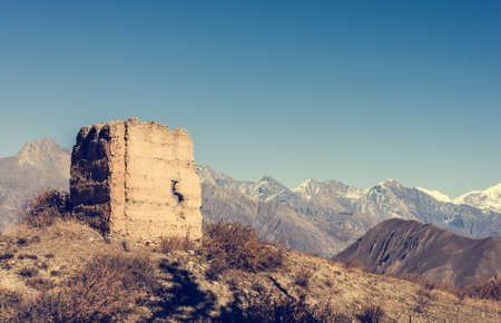 Ancient watch tower with mountain scenery. Dhaulagiri, Nepalの写真素材