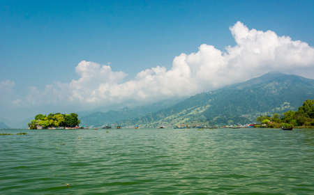 Landscape of green lake with island.の写真素材