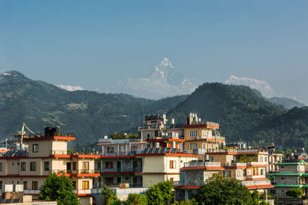 Rooftop view of mountains rising in distance.の写真素材