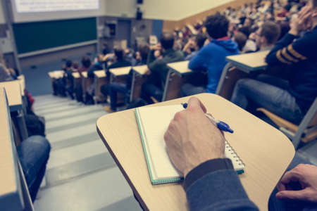 Taking notes at conference.の写真素材