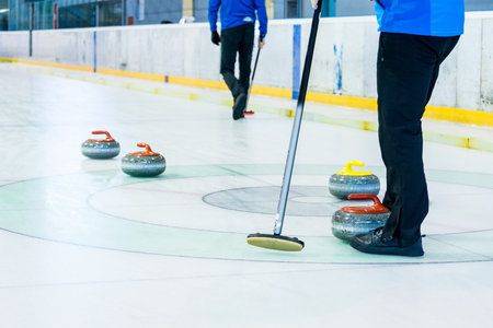 Playing a game of curling.