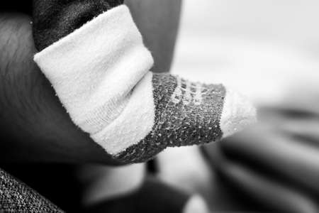 Closeup of tiny baby socks.の写真素材
