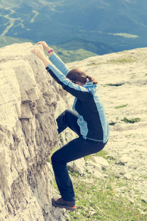 Attractive brunette rock climbing.の写真素材
