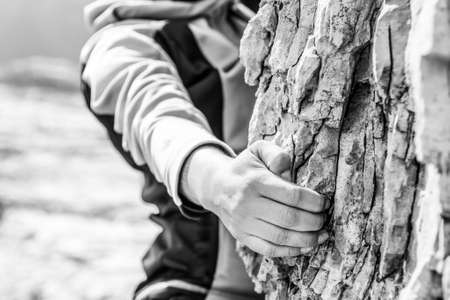 Closeup of female hand rock climbing.の写真素材