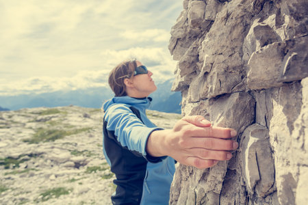 Attractive brunette rock climbing.