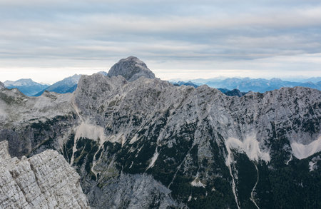 Mountain landscape of sheer ridge above valley.の写真素材