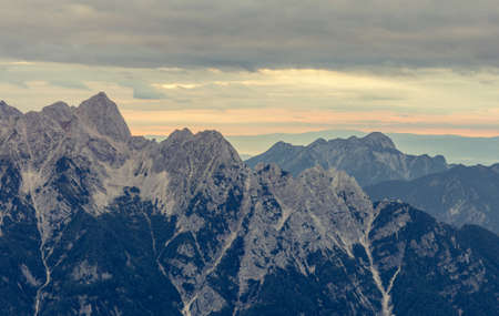 Sunrise behind a mountain ridge.の写真素材